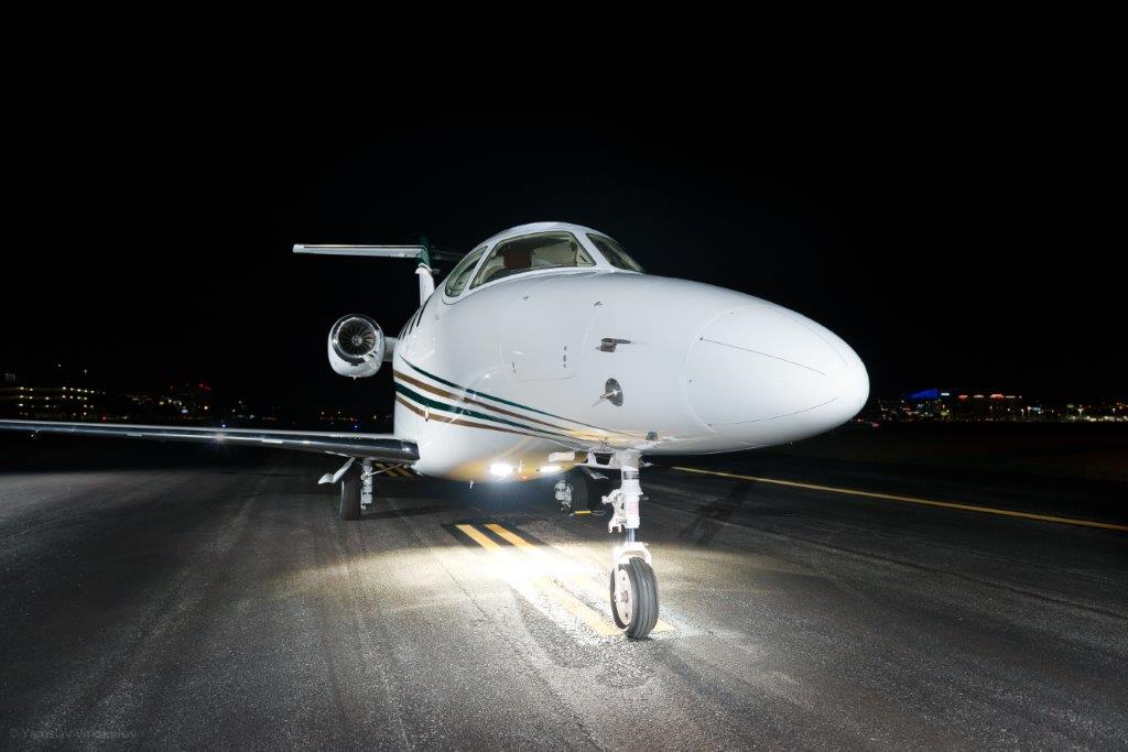 Beechcraft Premier Jet Series Landing Lights At Night on Runway