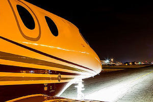 Beechcraft Premier Jet Series Landing Lights At Night on Runway
