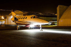Beechcraft Premier Jet Series Landing Lights At Night on Runway